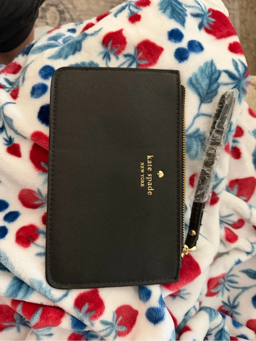 kate spade black zip-around wristlet with gold logo